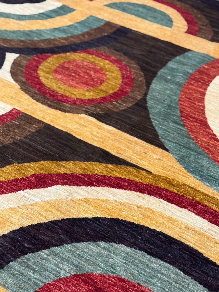 ORPHISM is part of our contemporary collection. Made from the finest hand-spun, vegetable-dyed wool, this contemporary rug is from a very limited production by Afghan weavers.