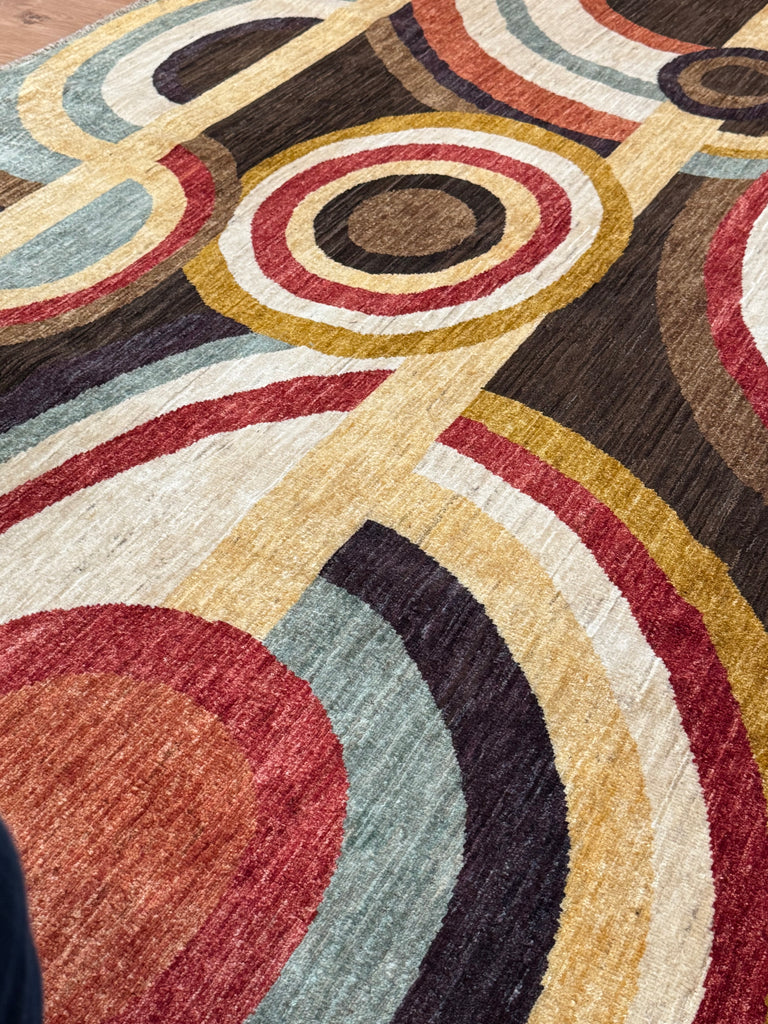 ORPHISM is part of our contemporary collection. Made from the finest hand-spun, vegetable-dyed wool, this contemporary rug is from a very limited production by Afghan weavers.