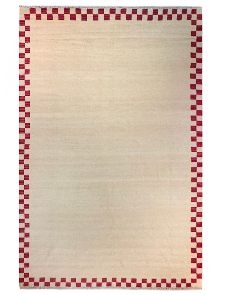 Chequerboarder rug in Plaster pink and toffee tones with jammy red border.