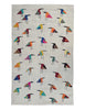 A woven Suzani rug with a light ecru linen-like background, decorated with rows of stylised bird figures in many different colours including blue, red, yellow, orange, green, and black.
